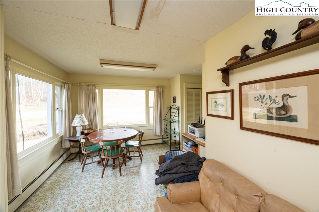 4634 Highway 421 Vilas, NC 28692 - Photo 22 of 28 a living room with furniture and a large window