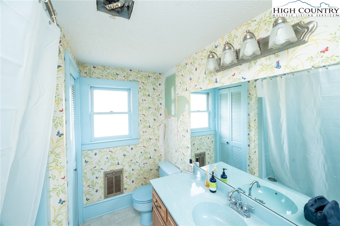 4634 Highway 421 Vilas, NC 28692 - Photo 28 of 28 a bathroom with a sink a mirror and a shower