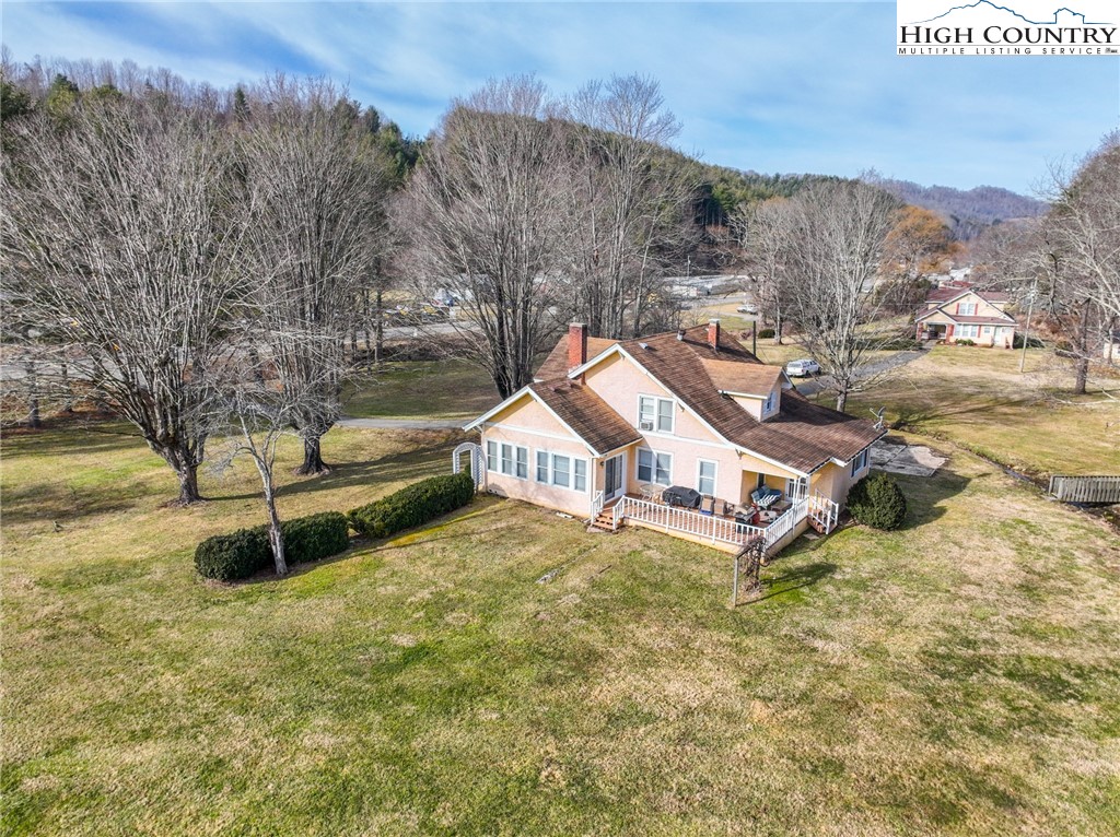 4634 Highway 421 Vilas, NC 28692 - Photo 9 of 28 a white house that has a tree in front of it