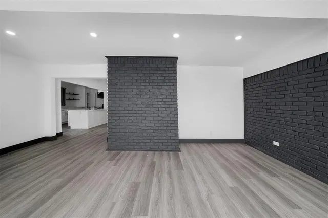 a backyard of a house with plants and trees