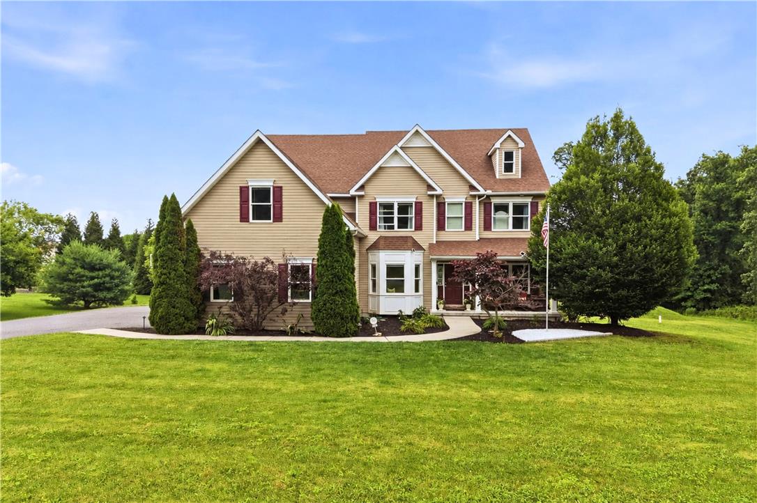 1212 Miller Road Wind Gap, PA 18091 - Photo 5 of 73 A classic two-story residence with a charming bay window and inviting front porch, set on a verdant lawn.