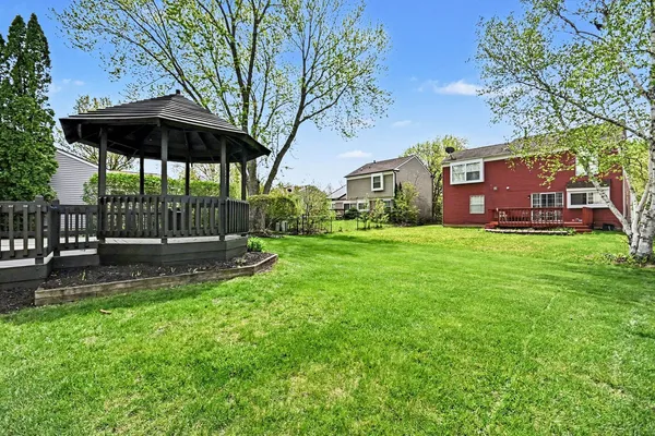 a view of a house with a yard porch and sitting area