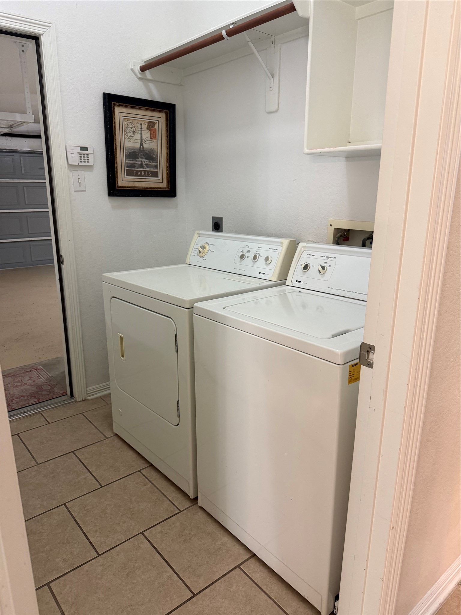 10002 Deer Track Court Houston, TX 77064 - Photo 13 of 15 a utility room with dryer and washer