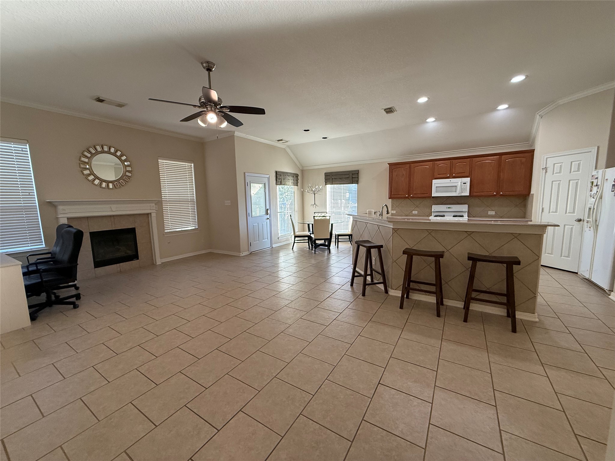 10002 Deer Track Court Houston, TX 77064 - Photo 4 of 15 a view of a livingroom with furniture and a fireplace