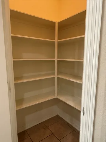 a view of wooden floor and windows in a room