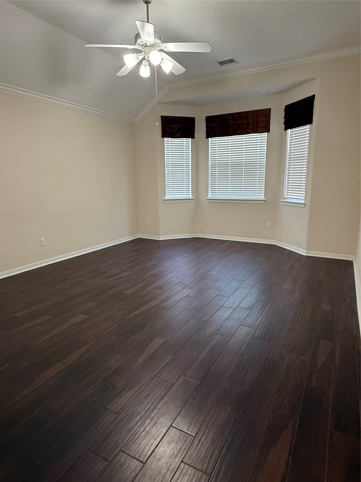 10002 Deer Track Court Houston, TX 77064 - Photo 7 of 15 a view of wooden floor and windows in a room