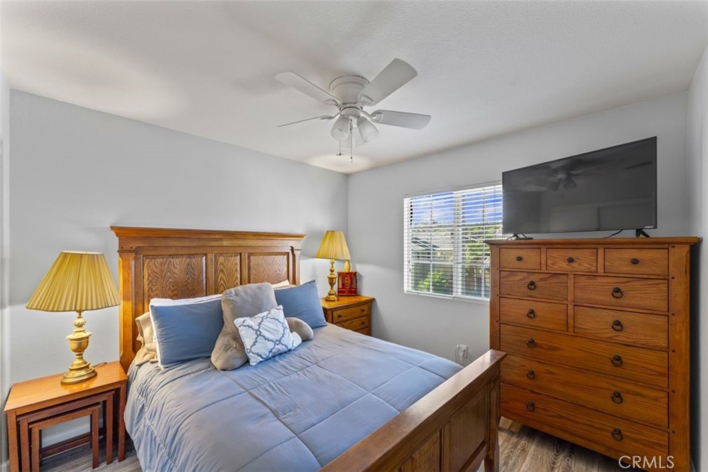 28340 Sycamore Drive Saugus, CA 91350 - Photo 19 of 34 a bedroom with a bed and wooden floor