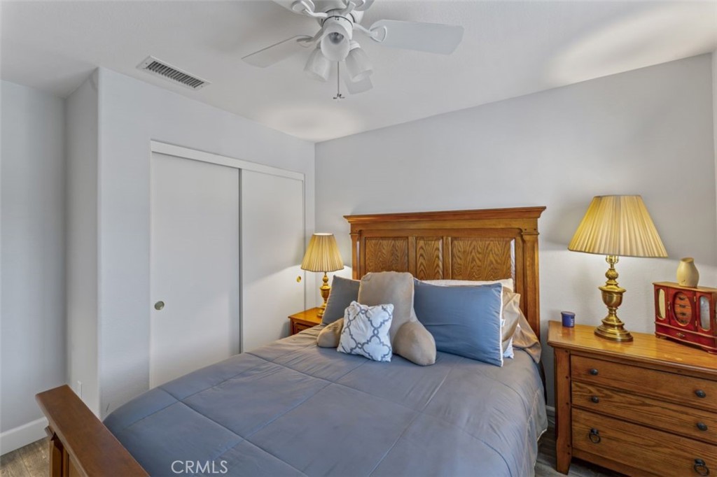 28340 Sycamore Drive Saugus, CA 91350 - Photo 20 of 34 a bed room with a bed and a lamp