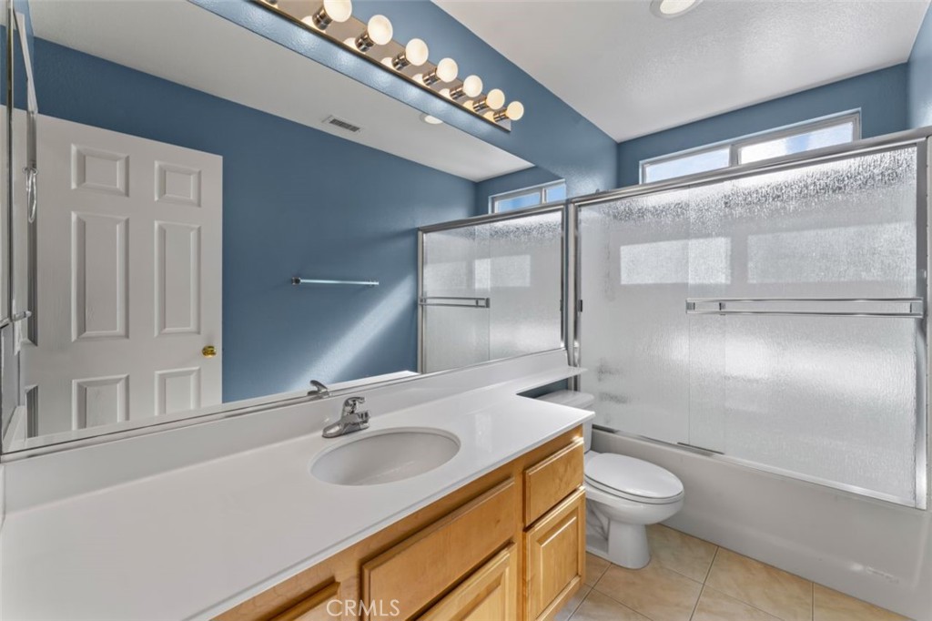 28340 Sycamore Drive Saugus, CA 91350 - Photo 21 of 34 a bathroom with a sink a toilet and shower