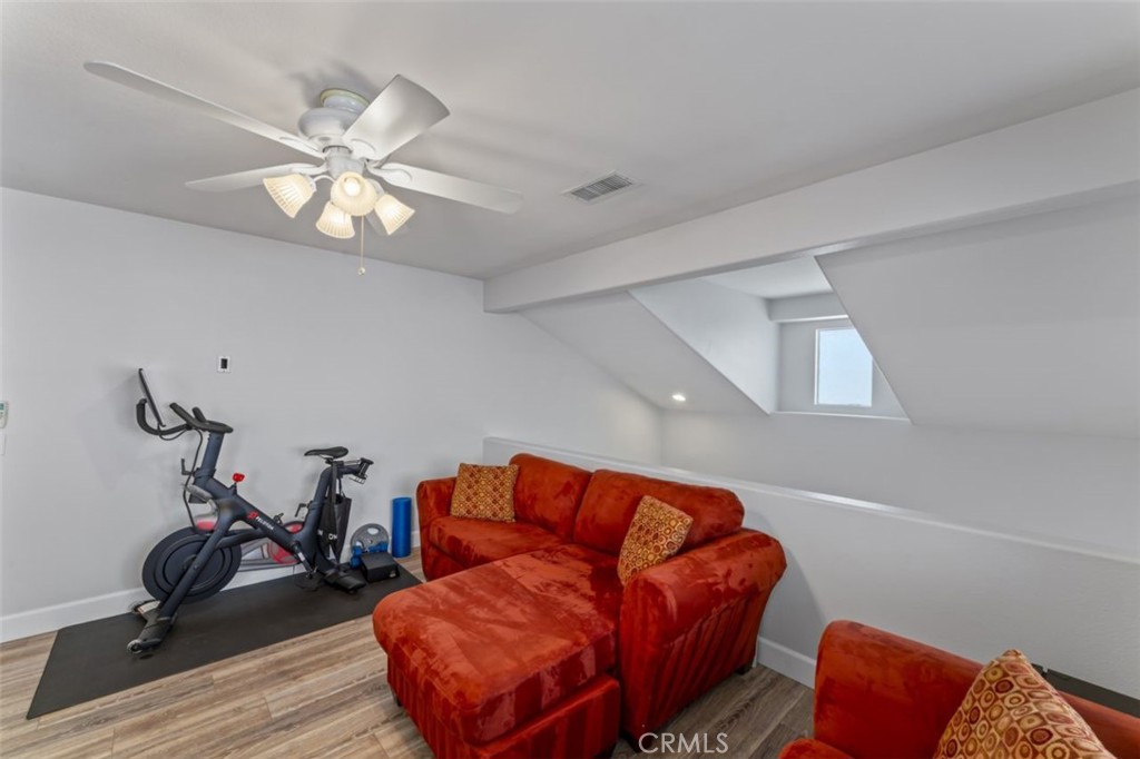 28340 Sycamore Drive Saugus, CA 91350 - Photo 25 of 34 a living room with furniture a flat screen tv and a window