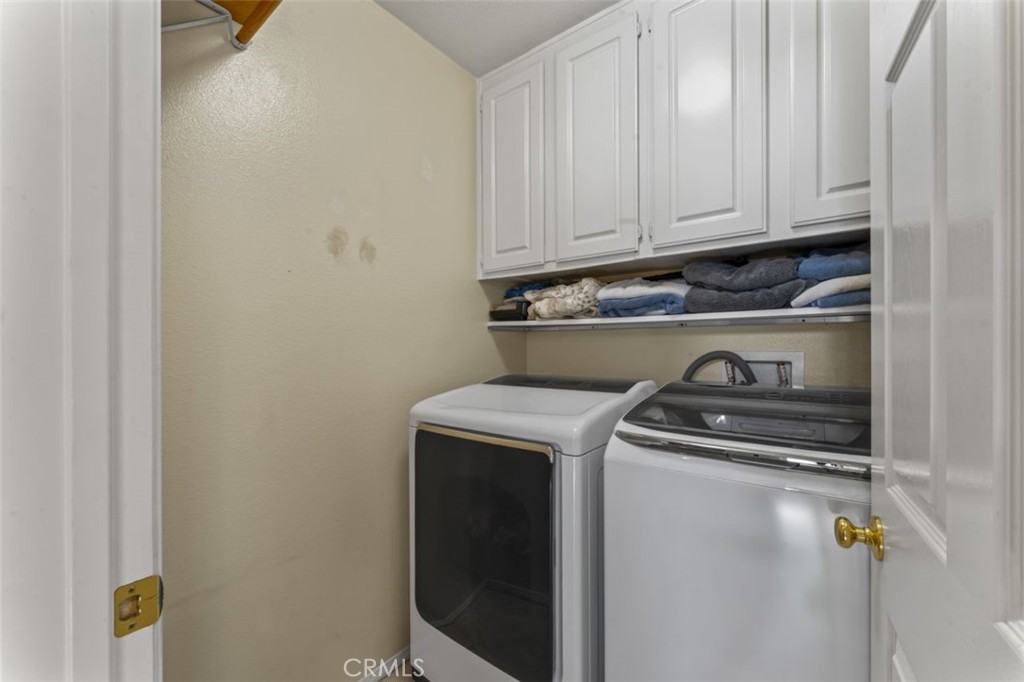 28340 Sycamore Drive Saugus, CA 91350 - Photo 26 of 34 a utility room with dryer and washer