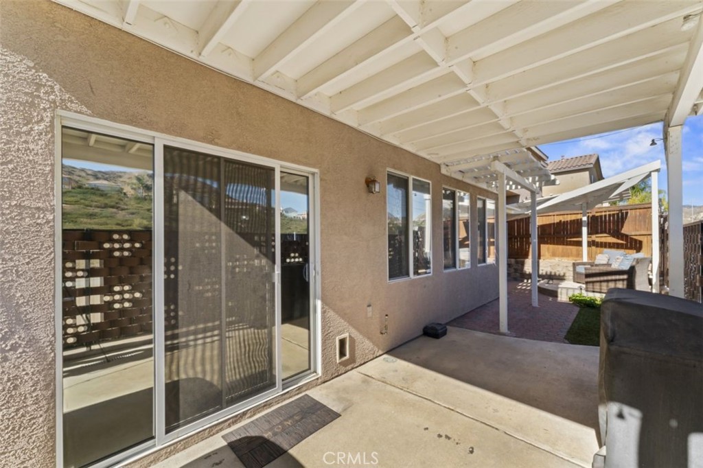 28340 Sycamore Drive Saugus, CA 91350 - Photo 28 of 34 a bedroom with furniture and large windows
