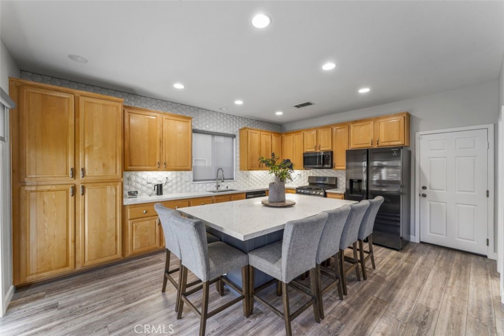 28340 Sycamore Drive Saugus, CA 91350 - Photo 9 of 34 a view of a dining room with furniture window and wooden floor
