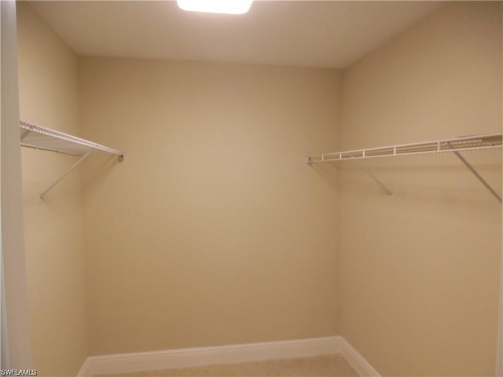 3055 52nd Street Southwest Naples, FL 34116 - Photo 13 of 21 a view of small space with racks on the wall