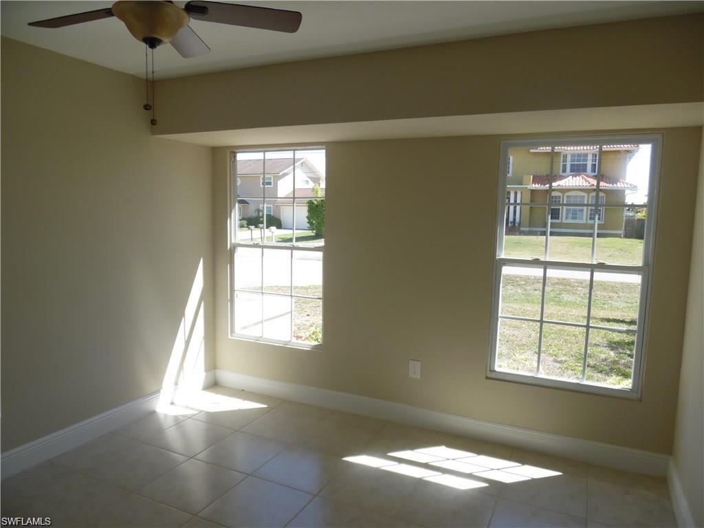 3055 52nd Street Southwest Naples, FL 34116 - Photo 14 of 21 a view of an empty room with a window