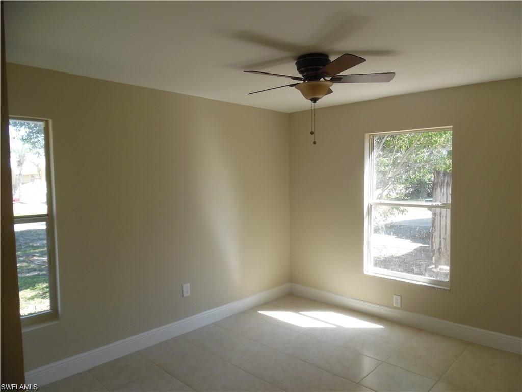 3055 52nd Street Southwest Naples, FL 34116 - Photo 15 of 21 a view of an empty room and a window