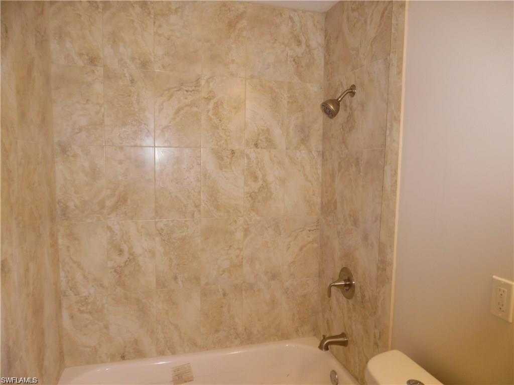 3055 52nd Street Southwest Naples, FL 34116 - Photo 17 of 21 a bathroom with a shower and a toilet
