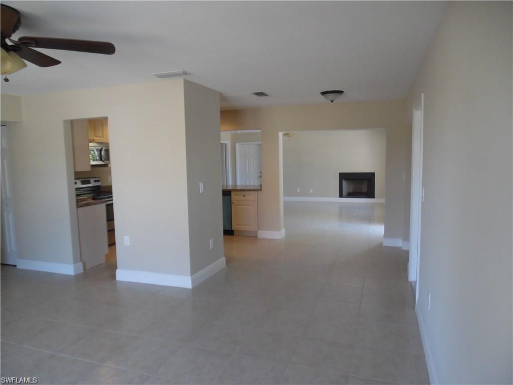 3055 52nd Street Southwest Naples, FL 34116 - Photo 6 of 21 a view of empty room with kitchen