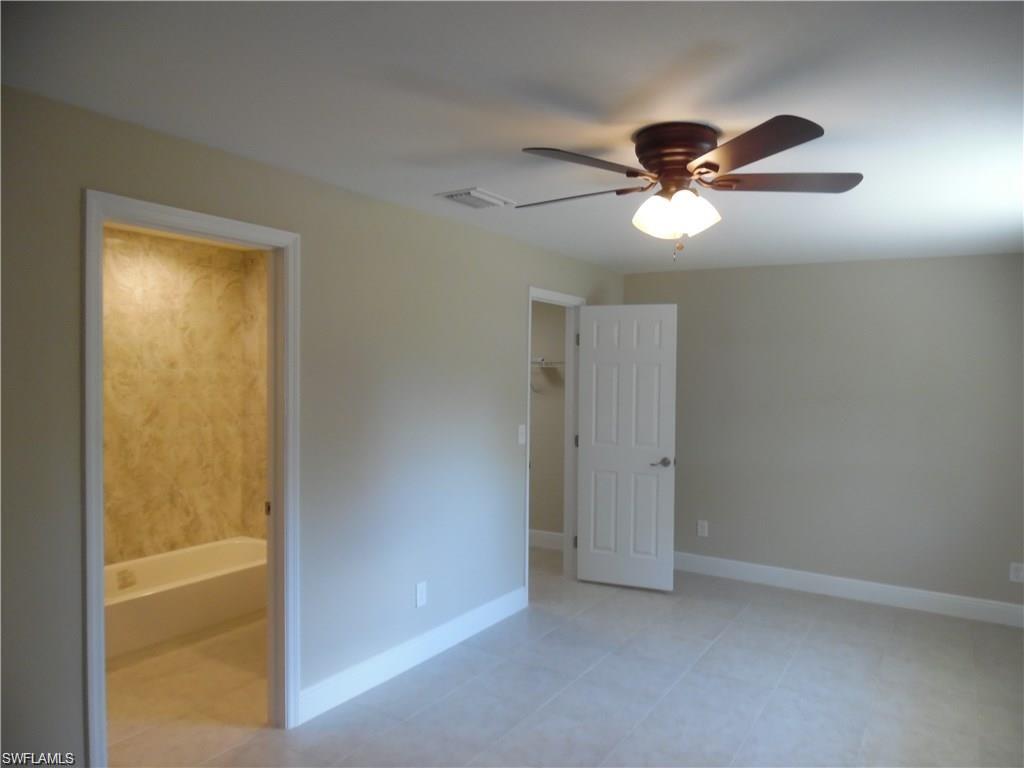 3055 52nd Street Southwest Naples, FL 34116 - Photo 7 of 21 a view of empty room with window