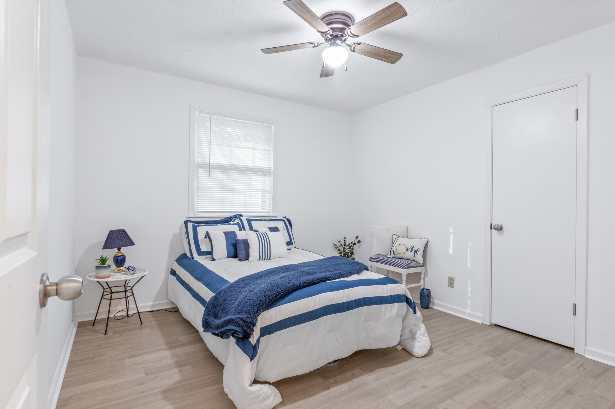 110 Nottingham Road Dickson, TN 37055 - Photo 21 of 34 a bedroom with a bed and a chandelier