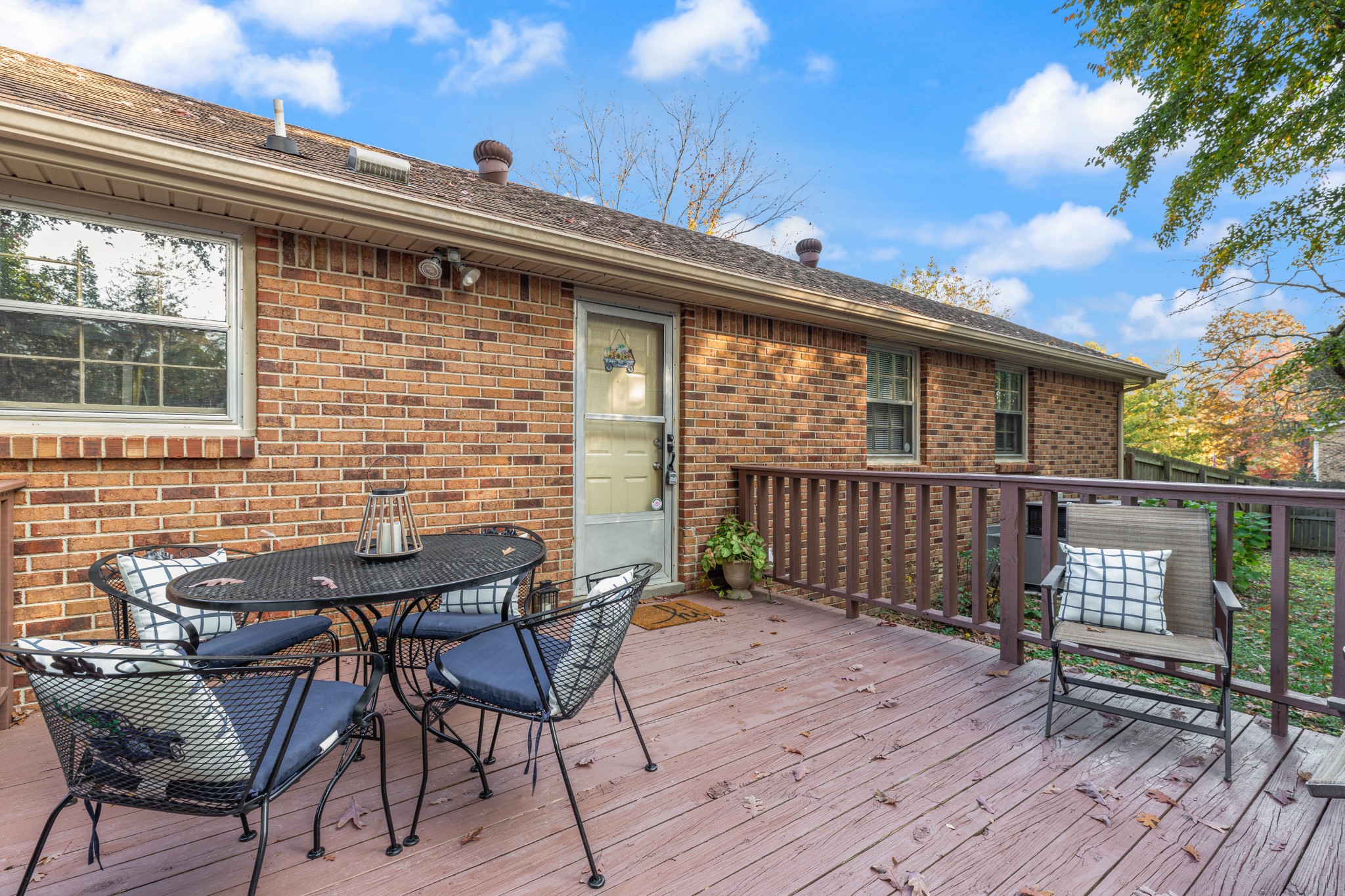 110 Nottingham Road Dickson, TN 37055 - Photo 27 of 34 a view of a roof deck with table and chairs with wooden floor and fence