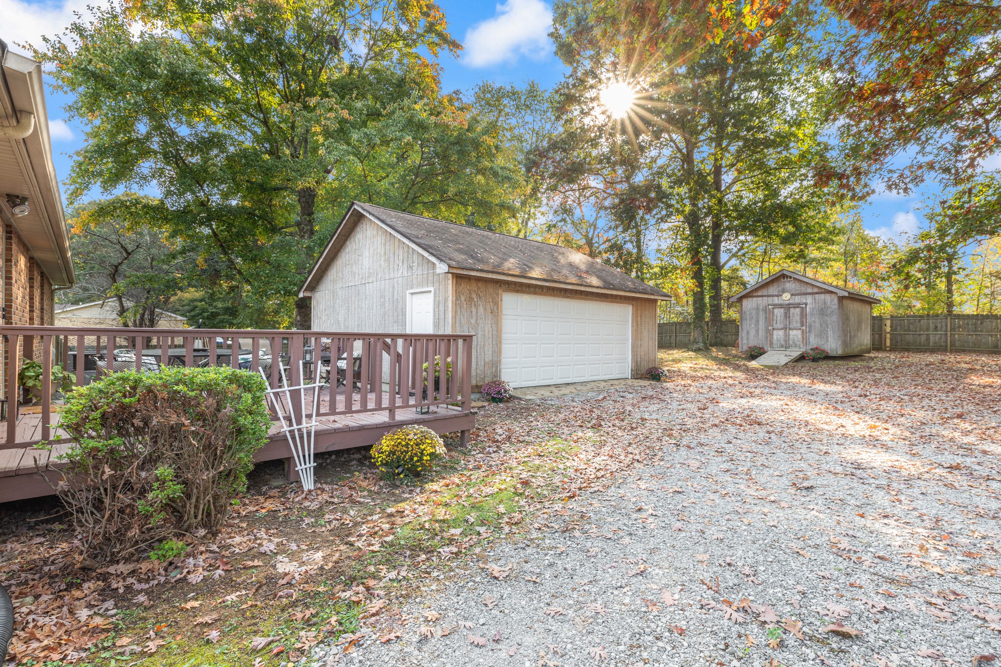 110 Nottingham Road Dickson, TN 37055 - Photo 29 of 34 a wooden house with large trees and wooden fence