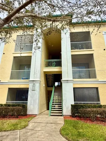 a view of front door of house with a yard