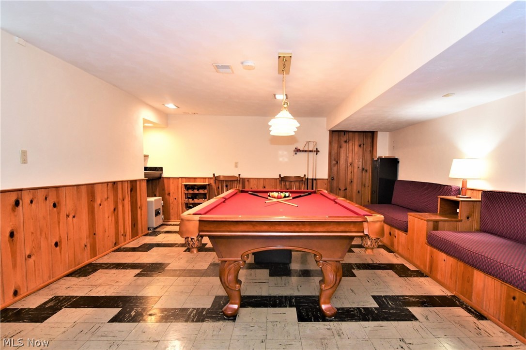 404 Somerset Road Akron, OH 44313 - Photo 21 of 25 Lower level Rec. Room with built-in seating and beautiful pool table is included