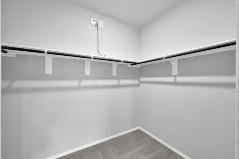 a view of an empty walk in closet