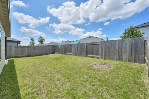 a swimming pool with wooden fence