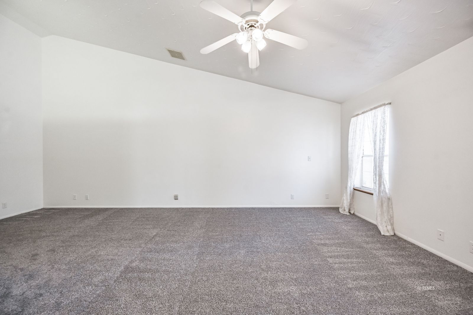 1209 West Robert Avenue Ridgecrest, CA 93555 - Photo 35 of 50 an empty room with an entryway and fan