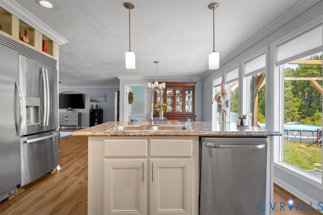 2181 Mill Quarter Road Ford, VA 23850 - Photo 18 of 56 Kitchen island with an undermount sink, pendant li