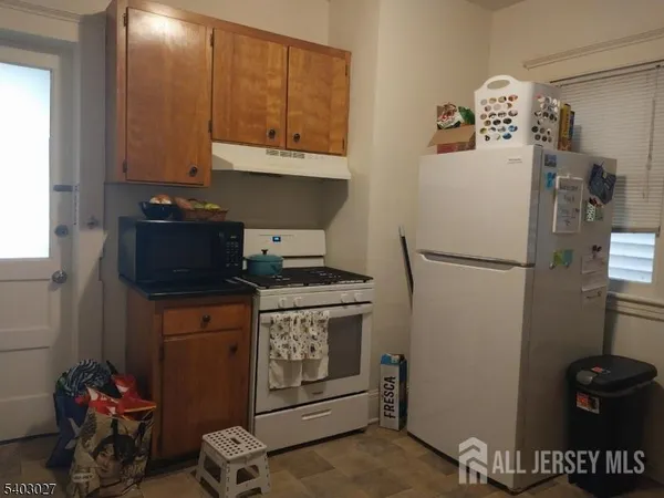 a kitchen with appliances and cabinets