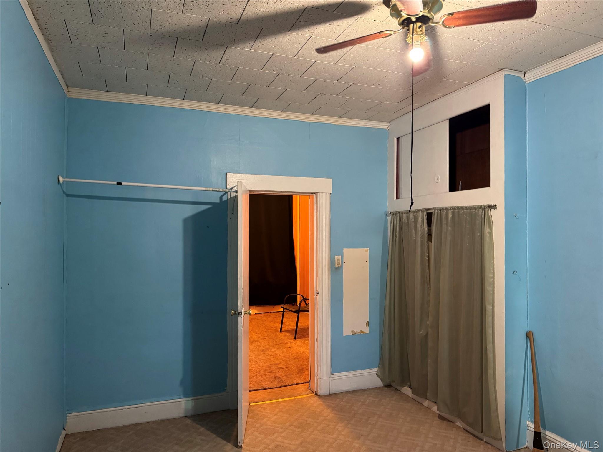 44-11 65th Street Queens, NY 11377 - Photo 12 of 29 a view of a hallway with a chandelier fan