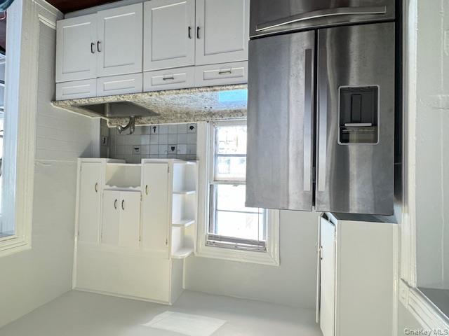 44-11 65th Street Queens, NY 11377 - Photo 23 of 29 a kitchen with stainless steel appliances granite countertop a refrigerator and a sink