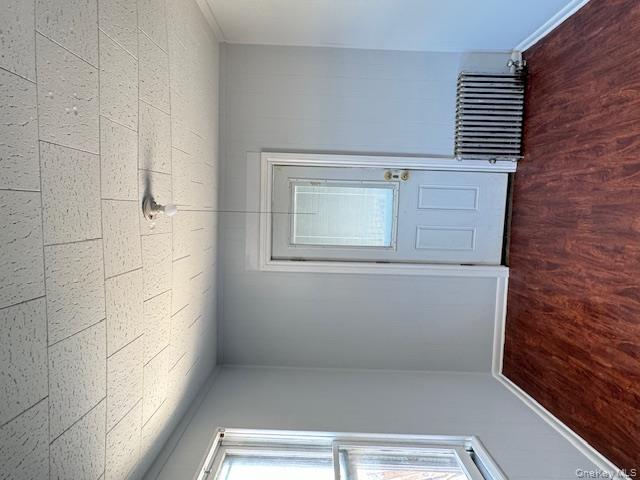 44-11 65th Street Queens, NY 11377 - Photo 24 of 29 an empty room with wooden floor & windows