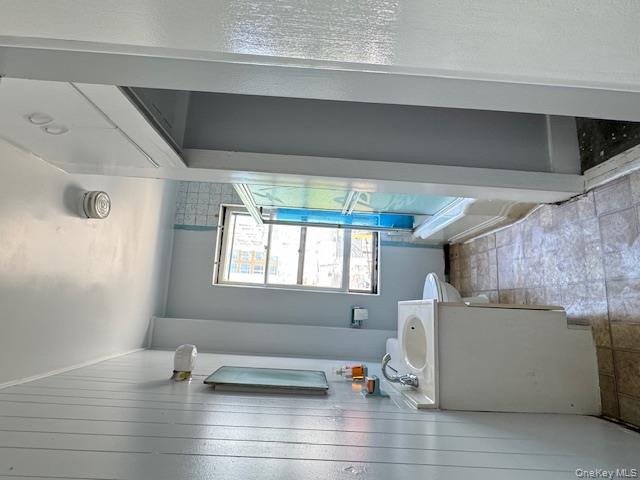 44-11 65th Street Queens, NY 11377 - Photo 25 of 29 a bathroom with a sink mirror toilet and bathtub