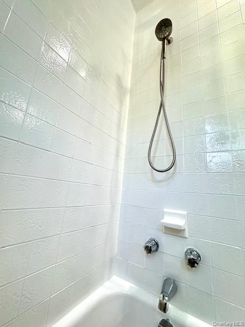 44-11 65th Street Queens, NY 11377 - Photo 26 of 29 a bathroom with a shower