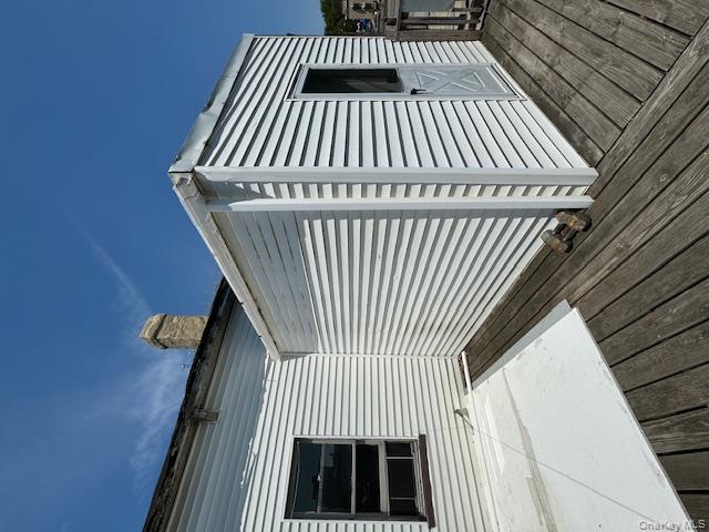 44-11 65th Street Queens, NY 11377 - Photo 4 of 29 a view of a street with wooden fence