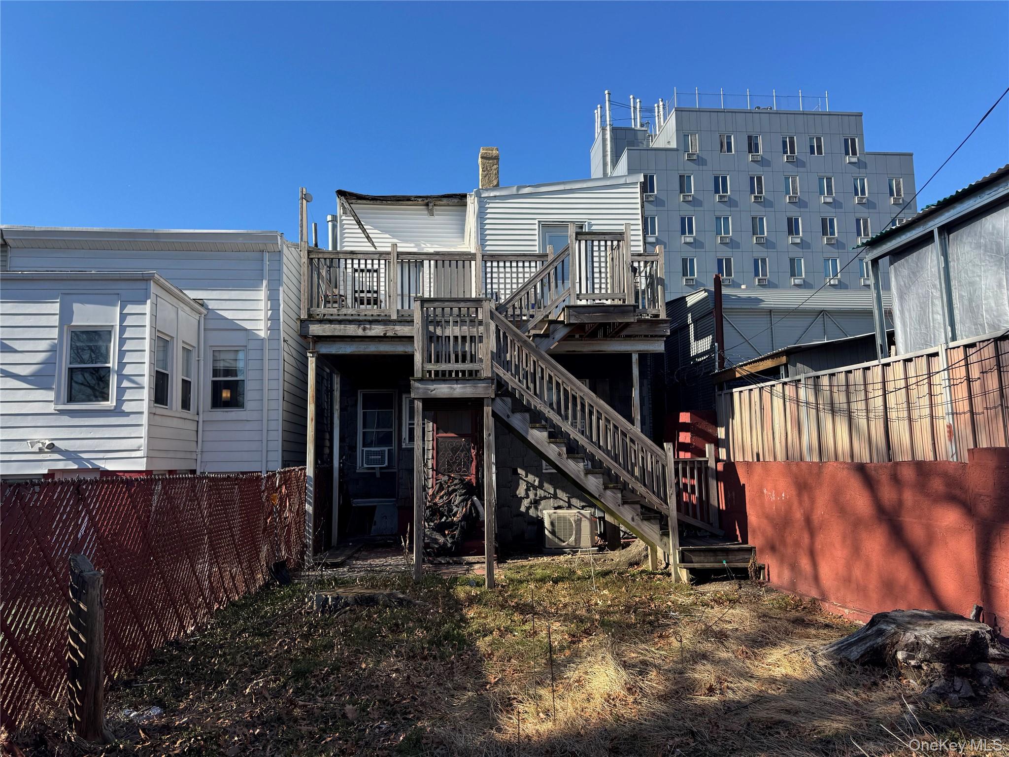 44-11 65th Street Queens, NY 11377 - Photo 7 of 29 a view of a house with a wooden deck