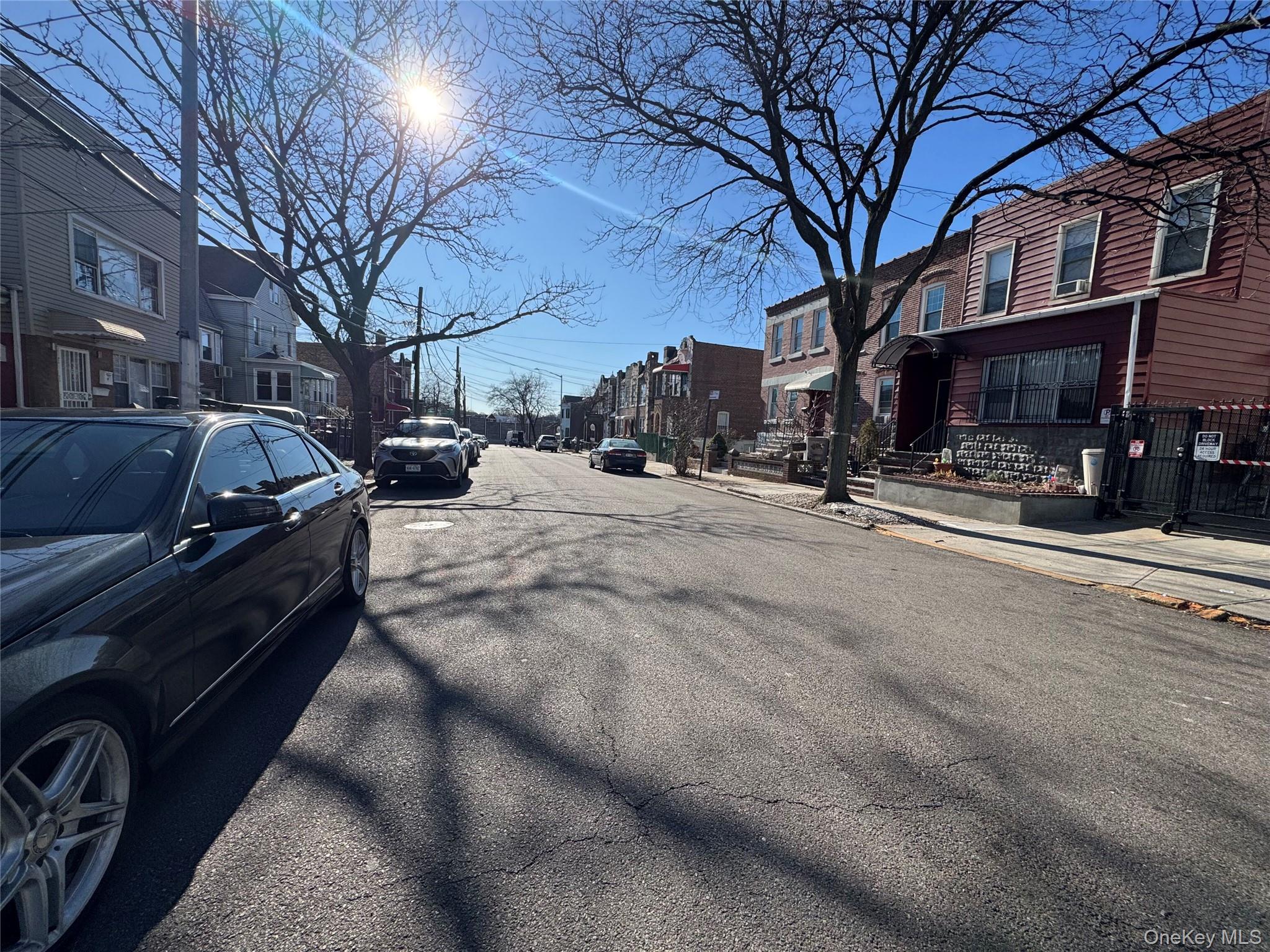 44-11 65th Street Queens, NY 11377 - Photo 8 of 29 a view of a city street with a building