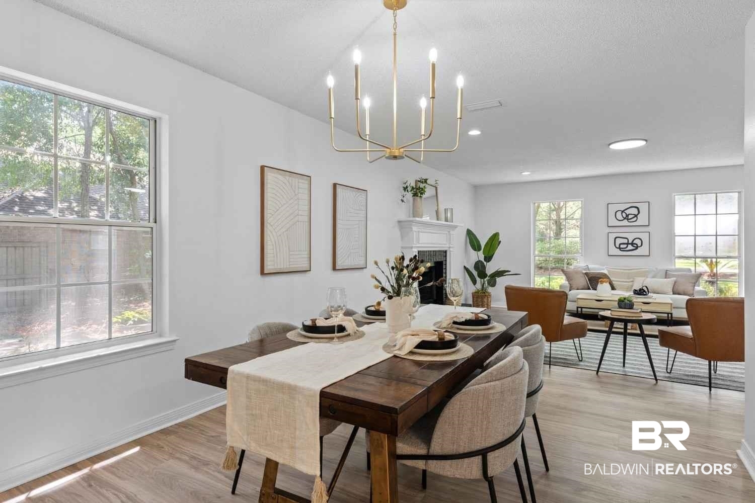 10251 Windmill Road Fairhope, AL 36532 - Photo 21 of 44 Dining space with a fireplace, light wood-style flooring, a chandelier, and recessed lighting