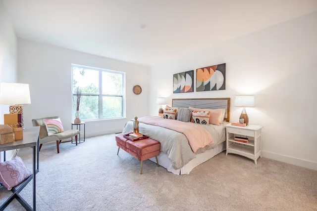 a bedroom with a bed and a couch