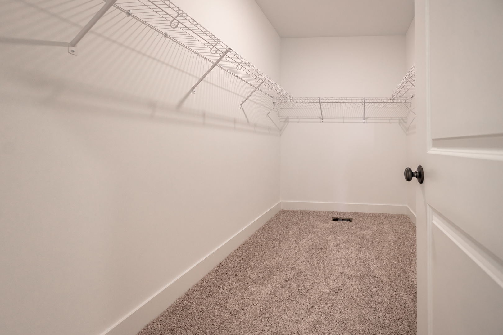 283 Wild Prairie Pointe Hampshire, IL 60140 - Photo 23 of 32 a view of a room with racks on the wall