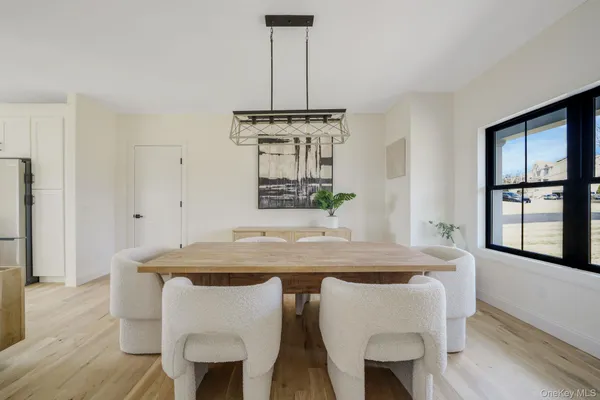 a dining table with a chandelier