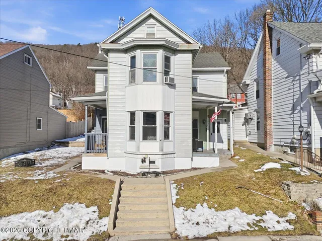 a front view of a house with swimming pool