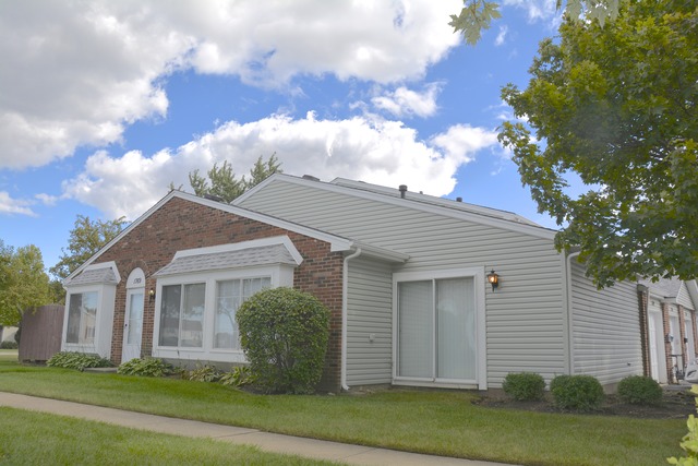 1769 Raleigh Lane Hoffman Estates, IL 60169 - Photo 1 of 17 a view of a house with a yard