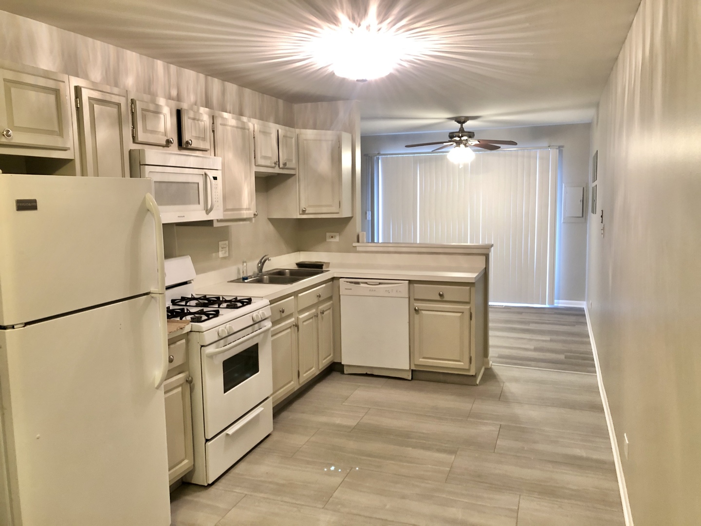 1769 Raleigh Lane Hoffman Estates, IL 60169 - Photo 2 of 17 a kitchen with stainless steel appliances granite countertop a stove a refrigerator and a white cabinets