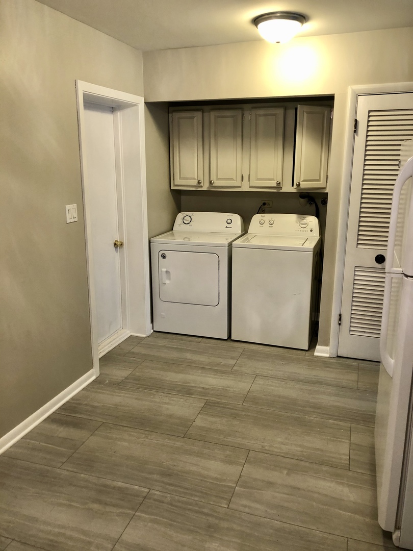 1769 Raleigh Lane Hoffman Estates, IL 60169 - Photo 13 of 17 a utility room with wooden floor washer and dryer