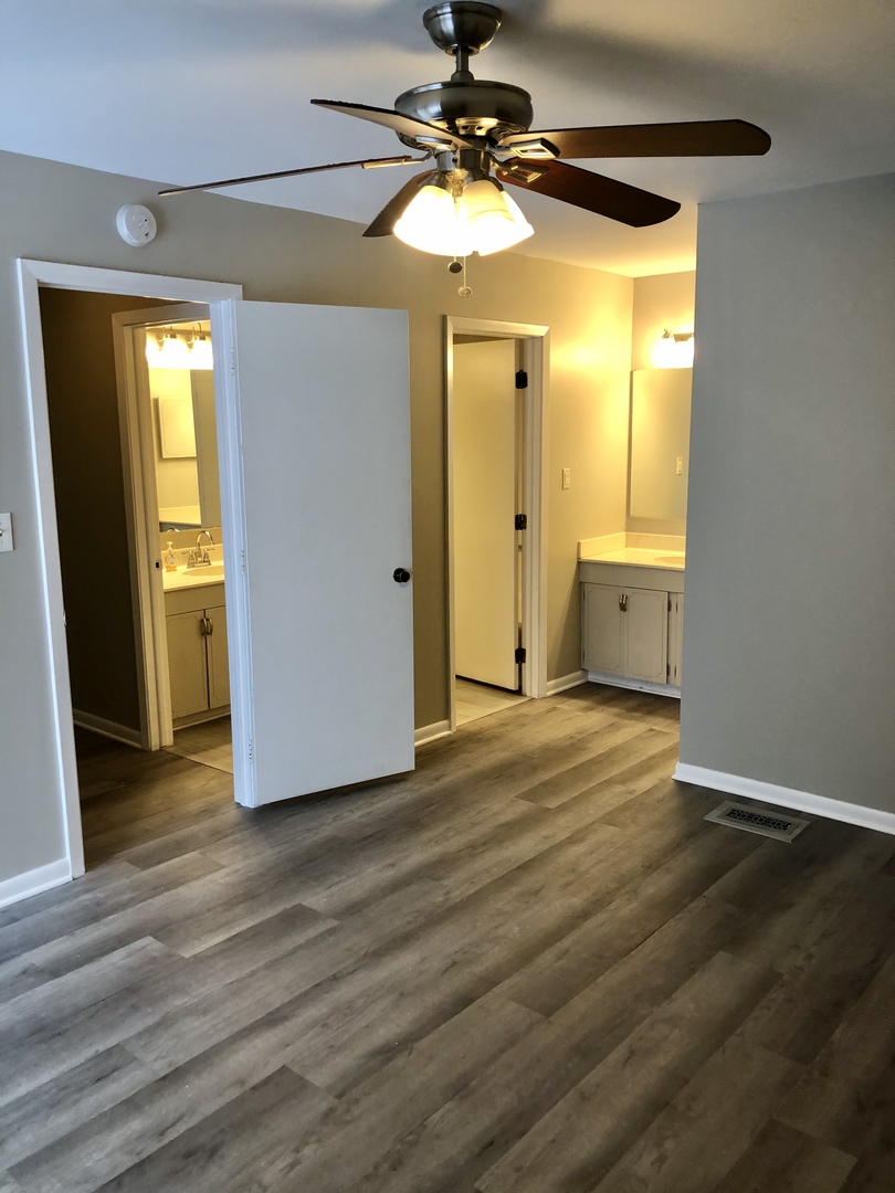 1769 Raleigh Lane Hoffman Estates, IL 60169 - Photo 17 of 17 a view of a room with wooden floor and door